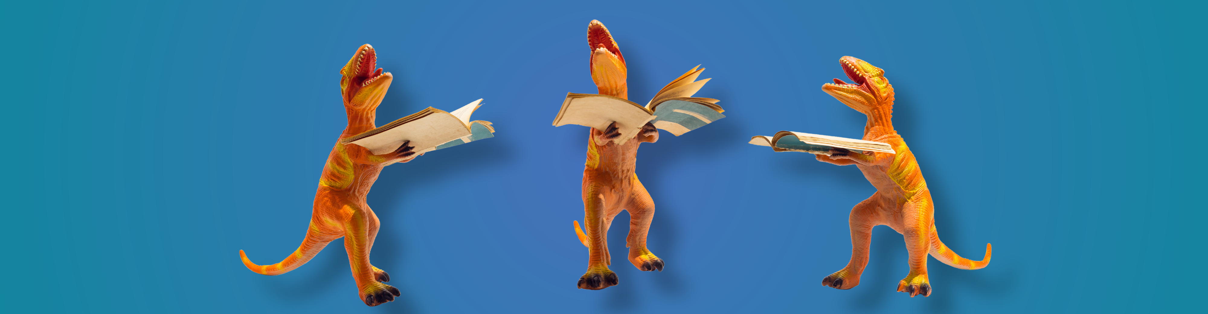 toy dinosaurs with books